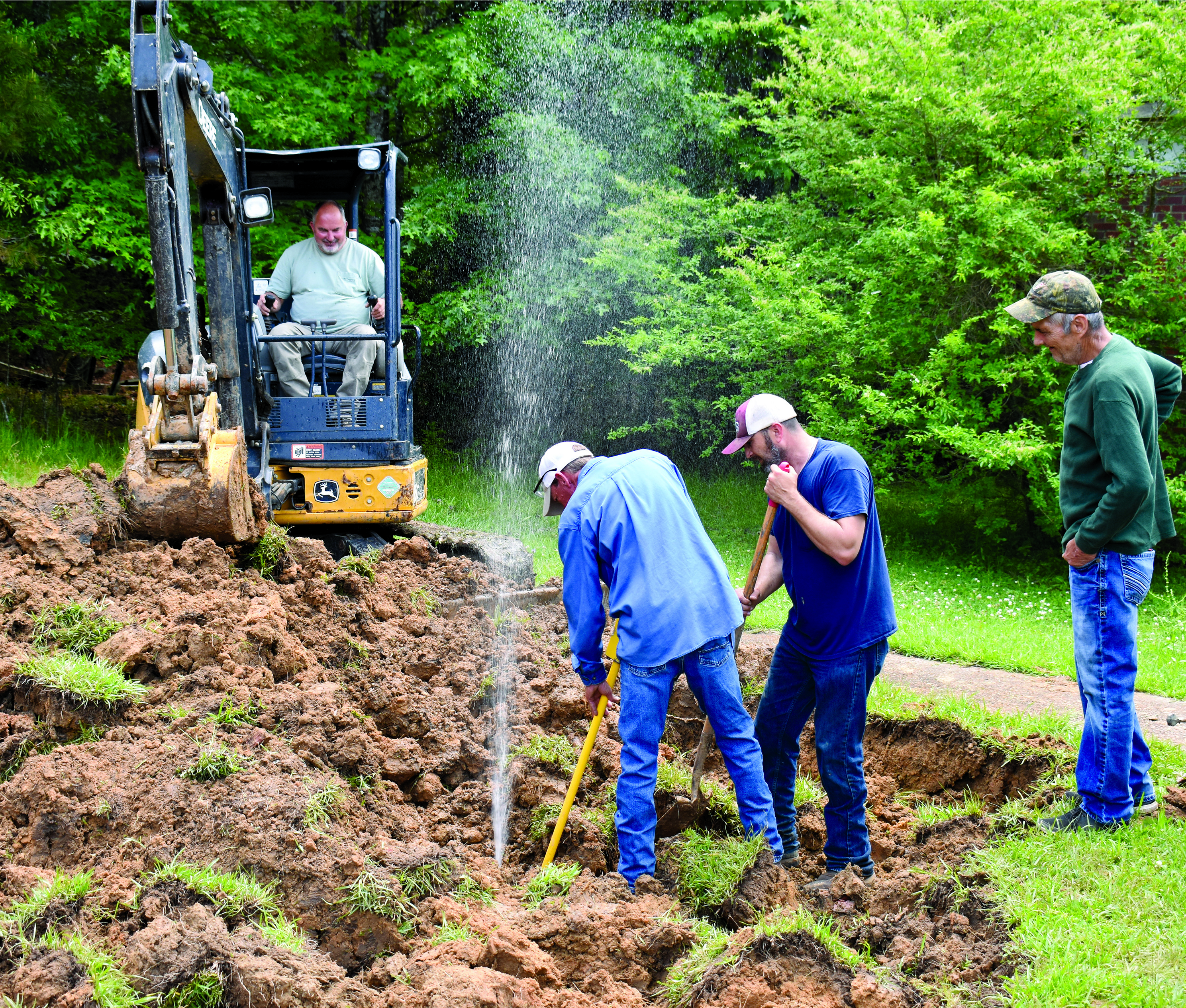 After starting with one shovel, then several, the group called for a backhoe to help dig up their time capsule. That led to a water line break. Then the backhoe could not be restarted, bringing the search to a halt.