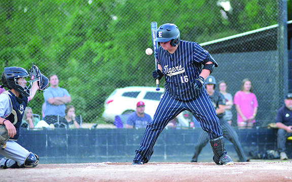 Tyler Weaver watches a high pitch pass near eye level.. Karen Fioretti / The Star-Herald