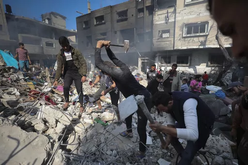 Palestinians search for survivors after an Israeli strike on the Gaza Strip in Nusseirat refugee camp, central Gaza Strip, Nov. 17, 2023. Workers from the State Department to the Pentagon have endorsed open letters demanding President Joe Biden pursue a cease-fire in the Israel-Hamas war. Congressional staffers have spoken out from the Capitol against what they say is their bosses' silence on the war's toll among Palestinian civilians. It's an unusual public challenge from within the government 