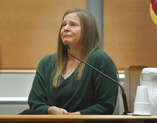 Alissa Parker, mother of deceased Sandy Hook Elementary School student Emilie Parker, breaks down in tears as she testifies in the Alex Jones defamation trial at Superior Court in Waterbury, Conn. on Wednesday, Sept. 28, 2022. (Brian A. Pounds/Hearst Connecticut Media via AP, Pool)