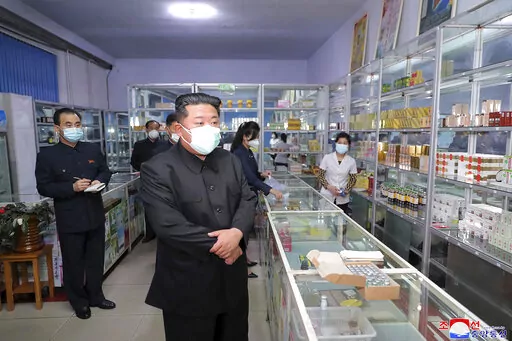 In this photo provided by the North Korean government, North Korean leader Kim Jong Un, center, visits a pharmacy in Pyongyang, North Korea on May 15, 2022. Independent journalists were not given access to cover the event depicted in this image distributed by the North Korean government. The content of this image is as provided and cannot be independently verified. Korean language watermark on image as provided by source reads: "KCNA" which is the abbreviation for Korean Central News Agency. (Ko
