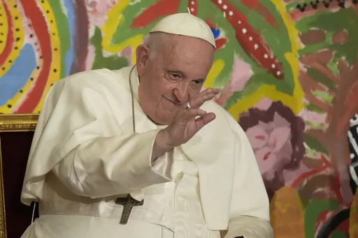 Pope Francis delivers his blessing as he attends the world's first meeting of the 'Educational Eco-Cities' promoted by the 'Scholas Occurrentes', at the Vatican, Thursday, May 25, 2023. (AP Photo/Andrew Medichini)