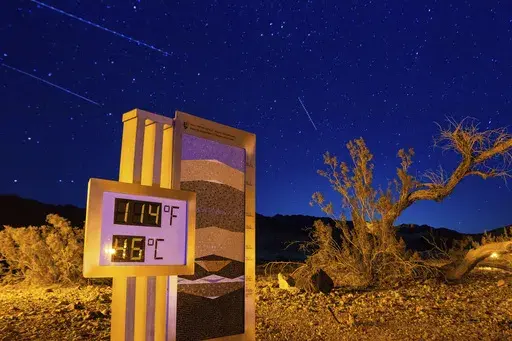 A long exposure image shows the recorded temperature on a thermostat at the Furnace Creek Visitors Center, after 10:00 p.m. July 7, 2024, in Death Valley National Park, Calif. (AP Photo/Ty ONeil, File)