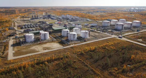 FILE- Oil storage tanks seen near the town of Usinsk, 1500 km (930 miles) northeast of Moscow, Russia, on Sept. 12, 2011.  The action Thursday, April 7, 2022, by the U.S. House and Senate to revoke Moscow's “most favored nation" trade status, and ban oil imports, intensifies the U.S. response to Russia's invasion of Ukraine amid mounting reports of atrocities. (AP Photo/Dmitry Lovetsky, File)