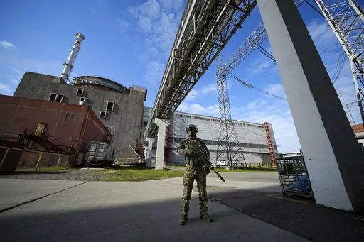 A Russian serviceman guards in an area of the Zaporizhzhia Nuclear Power Station in territory under Russian military control, southeastern Ukraine, May 1, 2022. The head of the U.N. nuclear watchdog says Ukraine’s Zaporizhzhia Nuclear Power Plant has switched to emergency diesel generators after losing its external power supply for the seventh time since Russia’s full-scale invasion. (AP Photo/File)