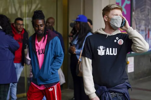 Members and supporters of the Amazon Labor Union stand outside an office of the National Labor Relations Board after a count of votes for unionization was concluded in New York, Monday, May 2, 2022. (AP Photo/Seth Wenig)