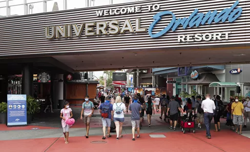 Visitors arrive at Universal Studios, June 3, 2020, in Orlando, Fla. The Universal Orlando Resort theme park in Florida plans to open a new land next year based on characters from DreamWorks Animation, company officials said Thursday, July 20, 2023. (AP Photo/John Raoux, File)