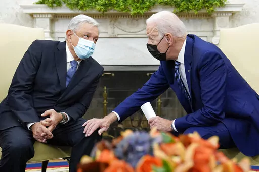 President Joe Biden meets with Mexican President Andrés Manuel López Obrador in the Oval Office of the White House in Washington, Nov. 18, 2021. President Andrés Manuel López Obrador will visit Washington Tuesday, July 12, 2022, to meet with President Joe Biden, a month after López Obrador snubbed Biden's invitation to the Summit of the Americas in Los Angeles. (AP Photo/Susan Walsh, File)