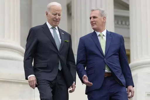 President Joe Biden talks with House Speaker Kevin McCarthy of Calif., as they walk down the House steps as they leave after attending an annual St. Patrick's Day luncheon gathering at the Capitol in Washington, March 17, 2023. The Tuesday, May 9, White House sitdown between the president and congressional leaders will be the first substantive talks between Biden and McCarthy in months, and comes weeks after House Republicans voted on a bill that would raise the debt limit but impose significant