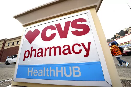 A CVS store sign is displayed in Pittsburgh on Friday, Feb. 3, 2023. CVS Health is plunging deeper into primary care services, buying Oak Street Health for approximately $10.6 billion. The drugstore chain said Wednesday, Feb. 8, 2023, it would pay $39 per share in cash for each share of Oak Street Health in a deal expected to close this year. (AP Photo/Gene J. Puskar)