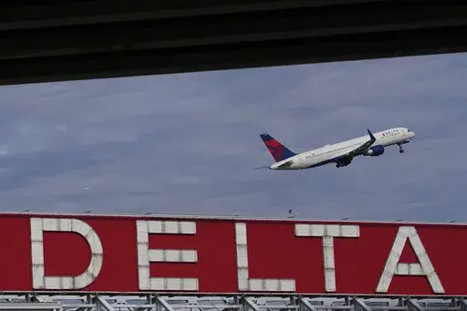 A Delta Air Lines plane takes off from Hartsfield-Jackson Atlanta International Airport in Atlanta, Nov. 22, 2022. Delta announced Thursday, Jan. 5, 2023, that it will provide free Wi-Fi service on most of its U.S. flights starting in February. (AP Photo/Brynn Anderson, File)