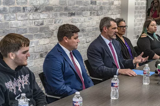 Attorney Tommy Hastings, third from left, speaks on behalf of his and fellow attorney Gabe Sassin's clients during a press conference, Wednesday, April 24, 2024 in The Woodland, Texas. Several relatives of patients who died while waiting for a new liver said Wednesday they want to know if their loved ones were wrongfully denied a transplant by Dr. Steve Bynon, a Houston doctor accused of manipulating the waitlist to make some patients ineligible to receive a new organ. (Kirk Sides/Houston Chroni