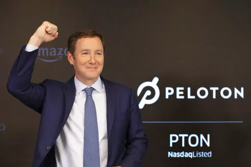 Peloton CEO John Foley celebrates at the Nasdaq MarketSite before the opening bell and his company's IPO, Sept. 26, 2019 in New York. Activist investor Blackwells Capital is asking Peloton to remove CEO John Foley and consider selling the company just a few days after a media report said the exercise and treadmill company was temporarily halting production of its connected fitness products amid waning consumer demand. (AP Photo/Mark Lennihan, file)