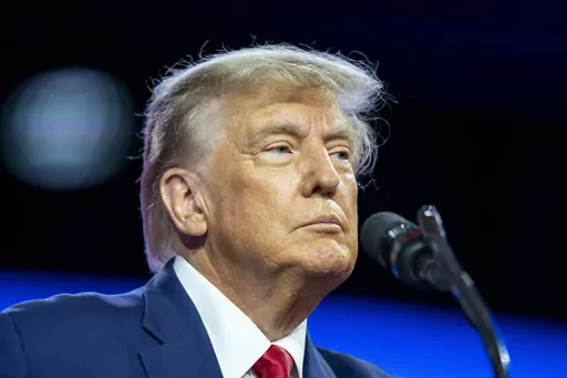 Former President Donald Trump speaks at the Conservative Political Action Conference, CPAC 2023, Saturday, March 4, 2023, at National Harbor in Oxon Hill, Md. Lawyers for an advice columnist who won a $5 million sex abuse and defamation jury verdict against Trump have urged a judge to reject his efforts to reduce the award to under $1 million. (AP Photo/Alex Brandon, File)