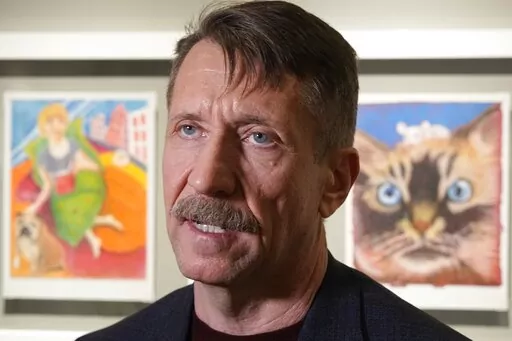 Viktor Bout, a Russian arms dealer who was sentenced to 25 years in the United States, speaks to the media prior to an opening ceremony of the exhibition of his artworks at the Mosfilm studio in Moscow, Russia, Tuesday, March 7, 2023. Bout has been brought back to Russia as a result of an agreement to exchange him for US basketball player Brittney Griner. (AP Photo/Alexander Zemlianichenko)