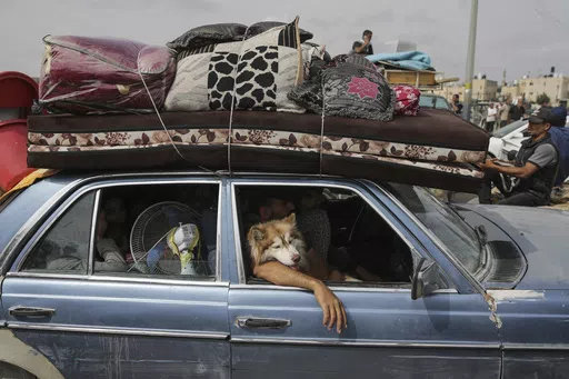 Palestinians flee from the southern Gaza city of Rafah during an Israeli ground and air offensive in the city on Tuesday, May 28, 2024. (AP Photo/Jehad Alshrafi)