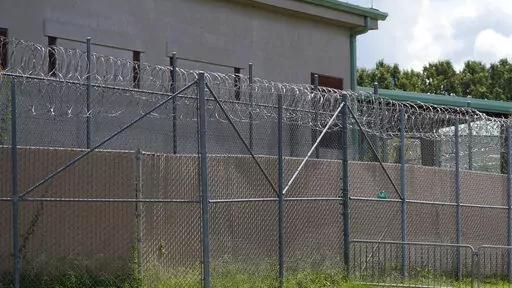 Rolls of razor wire line the top of the security fencing at the Raymond Detention Center in Raymond, Miss., on Aug. 1, 2022. Mississippi’s largest county secured a legal victory Wednesday, Dec. 28, in its effort to stave off a rare federal takeover of its jail, where a judge found “ongoing unconstitutional conditions" for inmates. (AP Photo/Rogelio V. Solis, File)