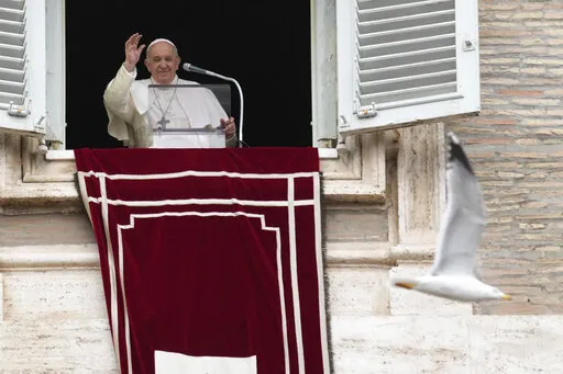 Pope Francis delivers the Angelus noon prayer in St. Peter's Square, at the Vatican, Sunday, Dec. 26, 2021. (AP Photo/Gregorio Borgia)
