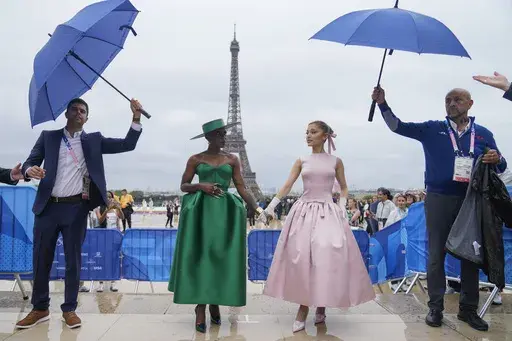 Cynthia Erivo, left, and Ariana Grande arrive in Paris, France, before the opening ceremony of the 2024 Summer Olympics, Friday, July 26, 2024. In "Wicked," Elphaba and Glinda travel from Shiz University to the Emerald City on a glistening green train to meet the wizard. In real life, Cynthia Erivo and Ariana Grande have traveled much farther and wider and longer and on airplanes to promote their hotly anticipated film. (AP Photo/Natacha Pisarenko, File)