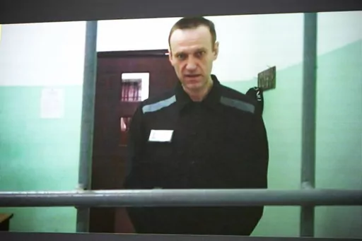 Russian opposition leader Alexei Navalny is seen on a TV screen as he appears in a video link provided by the Russian Federal Penitentiary Service from the colony in Melekhovo, Vladimir region, during a hearing at the Russian Supreme Court in Moscow, Russia, on June 22, 2023. The Kremlin on Tuesday Dec. 12, 2023 bristled at the U.S. voicing concern about Navalny who has vanished from his prison colony, denouncing it as “inadmissible interference” in the country's domestic affairs. Worries ab