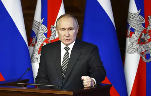 Russian President Vladimir Putin addresses an extended meeting of the Russian Defense Ministry Board at the National Defense Control Center in Moscow, Russia, Tuesday, Dec. 21, 2021. (Mikhail Tereshchenko, Sputnik, Kremlin Pool Photo via AP)