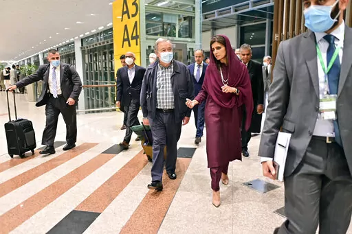 In this handout photo released by Pakistan Foreign Ministry Press Service, U.N. Secretary-General Antonio Guterres, center, was received on his arrival by Deputy Foreign Minister Hina Rabbani Khar, second right, in Islamabad, Pakistan, Friday, Sept. 9, 2022. U.N. Guterres appealed to the world to help Pakistan after arriving in the country Friday to see damage from the record floods that have killed hundreds and left more than half a million people homeless and living in tents under the open sky