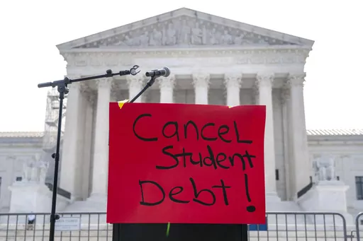 A sign reading "cancel student debt" is seen outside the Supreme Court, Friday, June 30, 2023, as decisions are expected in Washington. (AP Photo/Jacquelyn Martin)