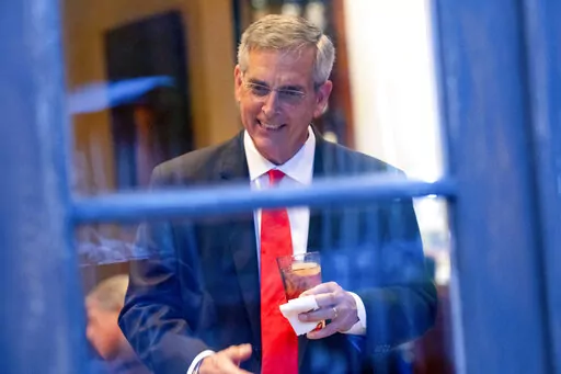 Georgia Secretary of State Brad Raffensperger talks with supporters during an election night party on May 24, 2022, at a restaurant in Peachtree Corners, Ga. (AP Photo/Ben Gray, File)