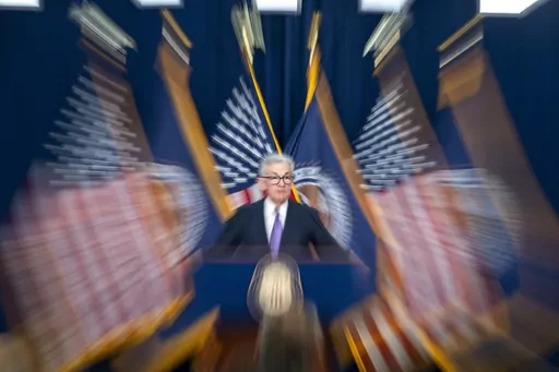 In this photo made with a slow shutter speed, Federal Reserve Board Chair Jerome Powell speaks during a news conference on Dec. 13, 2023, in Washington. Confidence is growing among Federal Reserve officials and many economists that high interest rates and healed supply chains will soon defeat inflation. (AP Photo/Alex Brandon, File)