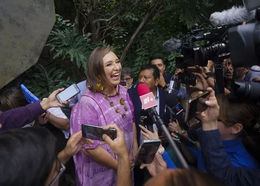 Senator Xochitl Galvez, an opposition presidential hopeful, speaks to the press after registering her name as a candidate in Mexico City, July 4, 2023. The street saleswoman turned tech entrepreneur is shaking up the contest to succeed Mexico's popular president, offering an alternative to Mexican President Andrés Manuel López Obrador’s dominant party. (AP Photo/Fernando Llano, File)