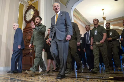 Ukrainian President Volodymyr Zelenskyy, second from left, walks with Senate Minority Leader Mitch McConnell of Ky., left, and Senate Majority Leader Chuck Schumer of N.Y., right, at Capitol Hill on Thursday, Sept. 21, 2023, in Washington. Congress broke for the holidays, not expected to return for two weeks while continued aid for Ukraine has nearly been exhausted. (AP Photo/Mark Schiefelbein, File)