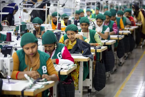Trainees work at Snowtex garment factory in Dhamrai, near Dhaka, Bangladesh, April 19, 2018. Bangladesh's economic miracle is under severe strain as fuel price hikes amplify public frustrations over rising costs for food and other necessities. (AP Photo/A.M. Ahad, File)