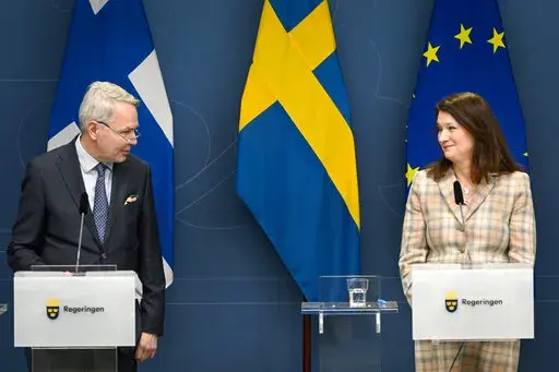 Finland's Minister for Foreign Affairs Pekka Haavisto, left and his Swedish counterpart Ann Linde take part in a joint press conference with Sweden's Defence Minister Peter Hultqvist, and his Finnish counterpart Antti Kaikkonen, in Stockholm, Sweden, Feb. 2, 2022, after talks on European security. Throughout the Cold War and in the decades since it ended, nothing could persuade Finns and Swedes that they would be better off joining NATO, until now. Russia’s invasion of Ukraine has profoundly c