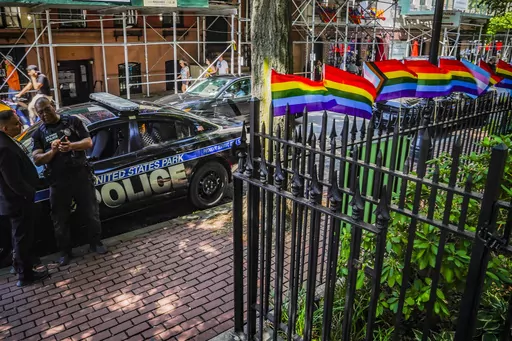 Pride flags, a symbol celebrating the LGBTQ+ community, decorate the fence at the Stonewall National Monument with U.S. Park police present, Tuesday, June 13, 2023, in New York. Dozens of LGBTQ+ Pride flags were damaged and ripped down at the monument over the weekend, the third such bout of vandalism during Pride Month at the LGBTQ+ landmark, police said. (AP Photo/Bebeto Matthews, File)