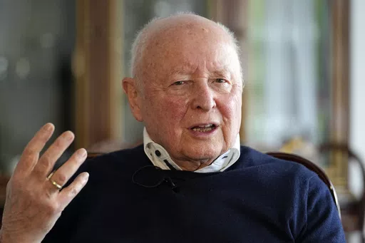 Holocaust survivor Herbert Rubinstein talks during an interview with The Associated Press at his home in Duesseldorf, Germany, Thursday, April 25, 2024. Holocaust survivors from around the globe participating in a new digital campaign called "#CancelHate" which features videos of them reading Holocaust denial posts from different social media platforms. (AP Photo/Martin Meissner)