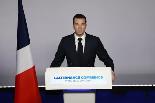Far-right National Rally party president Jordan Bardella delivers his speech after the first round vote of the legislative election, Sunday, June 30, 2024 in Paris. France's high-stakes legislative elections propelled the far-right National Rally to a strong but not decisive lead in the first-round vote Sunday, polling agencies' projected, dealing another slap to centrist President Emmanuel Macron after his risky decision to call voters back to the polls for the second time in three weeks. (AP P