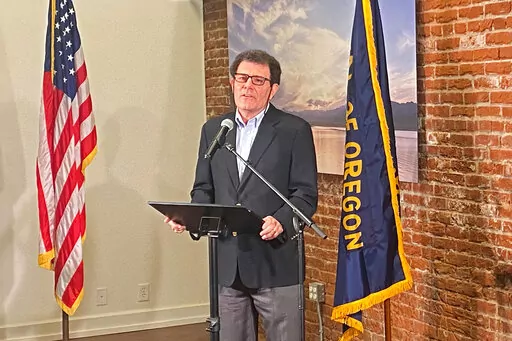 Former New York Times columnist Nick Kristof speaks at a news conference in Portland, Oregon, on Thursday, Feb. 17, 2022. The Oregon Supreme Court ruled Thursday Kristof is not eligible to run for governor because he does not meet the state's three-year residency requirement. (AP Photo/Sara Cline)