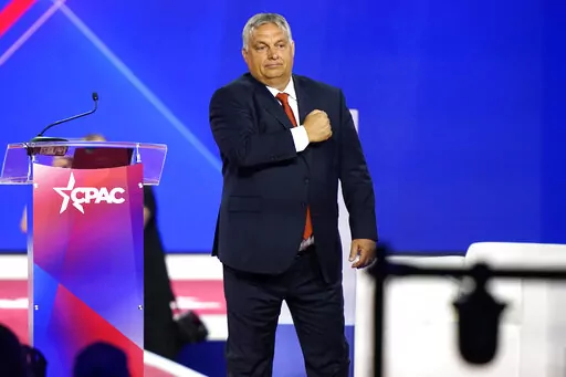 Hungarian Prime Minister Viktor Orban gestures with his fist on his chest after speaking at the Conservative Political Action Conference (CPAC) in Dallas, Thursday, Aug. 4, 2022. (AP Photo/LM Otero)