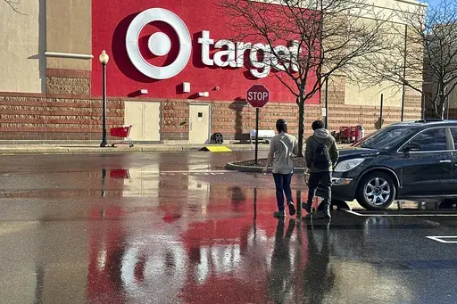 People walk towards a Target store in Clifton, N.J., on December 18, 2023. (AP Photo/Ted Shaffrey, File)