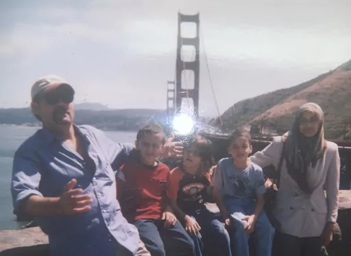 This undated image provided by Fadi Sckak shows a family photo of Abedalla Sckak with his wife Zahra Sckak and children. Abedalla Sckak, 56, died after being shot in the fighting in Gaza last month. He is the father of three American sons, including a U.S. service member. The family is hoping for rescue for the mother, Zahra Sckak, who is still trapped with another American relative in Gaza City. They are among 300 Americans, green card holders or close relatives still in Gaza and seeking help o
