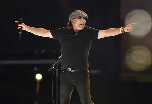 Brian Johnson of AC/DC performs with the Foo Fighters at "Vax Live: The Concert to Reunite the World" in Inglewood, Calif., on May 2, 2021. In his new memoir, the “Highway to Hell” singer recounts how he went from being a vinyl car roof fitter to leading one of the most hailed bands in the world. (Photo by Jordan Strauss/Invision/AP, File)