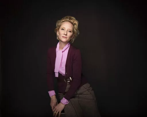 Actress Anne Heche poses for a portrait to promote the film, "The Last Word" during the Sundance Film Festival in Park City, Utah on Jan. 23, 2017. Heche, who first came to prominence on the NBC soap opera “Another World” in the late 1980s before becoming one of the hottest stars in Hollywood in the late 1990s, died Sunday, Aug. 14, 2022, nine days after she was injured in a fiery car crash. She was 53.  (Photo by Taylor Jewell/Invision/AP, File)