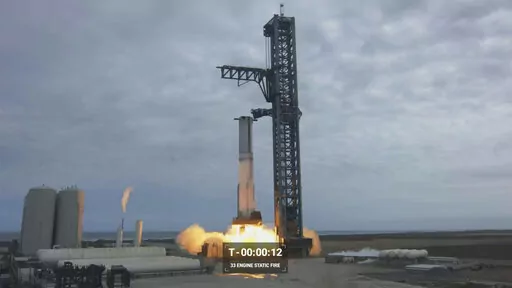 In this image from video made available by SpaceX, a Starship first-stage Super Heavy booster performs an engine-firing test at the launch pad in Boca Chica, Texas, on Thursday, Feb. 9, 2023. (SpaceX via AP)