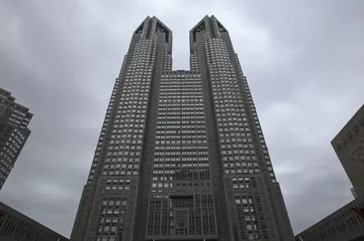 The Tokyo Metropolitan Government Office building soars in Tokyo, on June 15, 2016. Called “Tokyo Futari Story,” the city hall online site is just that: An effort to create couples, “futari,” in a country where it is increasingly common to be “hitori," or alone. (AP Photo/Shuji Kajiyama, File)