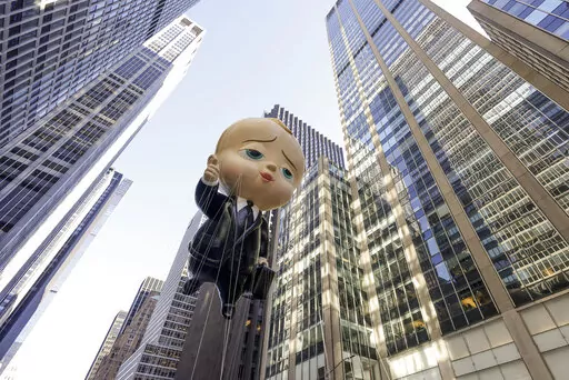 The Boss Baby balloon makes its way down Sixth Avenue during the Macy's Thanksgiving Day Parade, Thursday, Nov. 24, 2022, in New York. (AP Photo/Jeenah Moon)