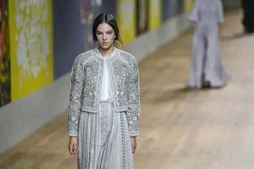 A model wears a creation as part of Dior's Haute Couture Fall/Winter 2022-2023 fashion collection presented Monday, July 4, 2022 in Paris. (AP Photo/Michel Euler)
