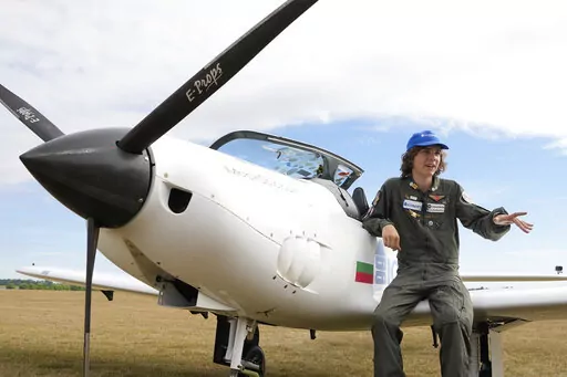Seventeen year old Anglo-Belgian pilot, Mack Rutherford, speaks with the media after landing at the Buzet airfield in Pont-A-Celles, Belgium, Tuesday, Aug. 23, 2022. Rutherford landed in Belgium before flying on to Slovakia and Sofia, Bulgaria, for the final leg of his Guinness World Record attempt to be the youngest person to the fly around the world solo in a small plane. (AP Photo/Virginia Mayo)