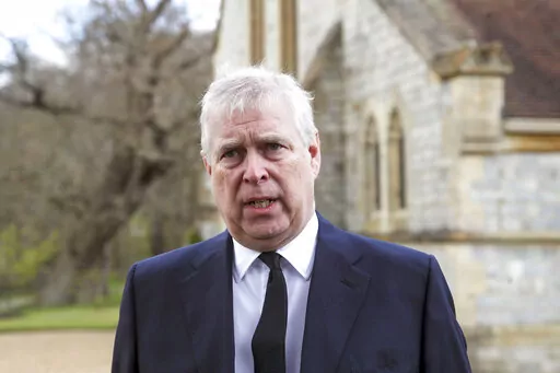 Britain's Prince Andrew speaks during a television interview at the Royal Chapel of All Saints at Royal Lodge, Windsor, April 11, 2021.  Lawyers for Prince Andrew and Virginia Giuffre, who accused him of sexually abusing her when she was 17, formally asked a judge Tuesday to dismiss her lawsuit. (Steve Parsons/Pool Photo via AP, File)