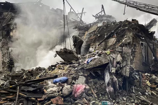 In this photo provided by the Ihor Moroz, Head of the Donetsk Regional Military Administration, rescuers work at the scene of a building damaged by shelling, in Novogrodivka, Ukraine, Thursday, Nov. 30, 2023. (Ihor Moroz, Head of the Donetsk Regional Military Administration via AP)