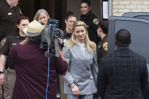 Actress Amber Heard departs the Fairfax County Courthouse Friday, May 27, 2022 in Fairfax, Va.  A jury heard closing arguments in Johnny Depp's high-profile libel lawsuit against ex-wife Amber Heard. Lawyers for Johnny Depp and Amber Heard made their closing arguments to a Virginia jury in Depp's civil suit against his ex-wife.(AP Photo/Craig Hudson)